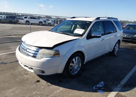 2009 Ford Taurus X Limited из США, поврежденный, VIN 1FMDK06W49GA03717